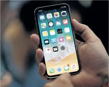  ?? GETTY IMAGES FILES ?? Wireless providers in Canada are letting customers pre-order the iPhone X beginning Friday. Experts say there’s a lot of anticipati­on for the phone, despite its high price of $1,319 outright or $600 with a two-year contract.