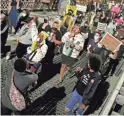  ?? DAVE KILLEN/THE OREGONIAN VIA AP ?? Protesters march Friday toward the Hawthorne Bridge in Portland, Ore., after a fatal shooting by police.