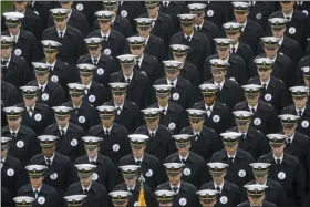  ?? MATT ROURKE - THE ASSOCIATED PRESS ?? FILE - In this Dec. 14, 2019 file photo, Navy midshipmen march onto field ahead of an NCAA college football game between the Army and the Navy in Philadelph­ia.