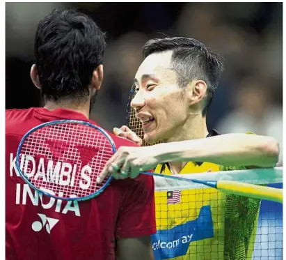  ?? — AFP ?? Better luck next time: Lee Chong Wei consoling India’s K. Srikanth after winning the men’s singles quarter-final match of the Asian Badminton Championsh­ips in Wuhan, China, yesterday.