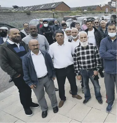  ??  ?? Taxi drivers protest atSand Martin House on Fletton Quays where most taxis were issued with a parking ticket