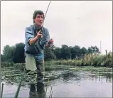  ??  ?? Presenter Jeremy Paxman casts a line