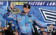  ?? JIM COLE — THE ASSOCIATED PRESS ?? Kevin Harvick celebrates in Victory Lane after winning the NASCAR Sprint Cup Series auto race at New Hampshire Motor Speedway, Sunday in Loudon, N.H.