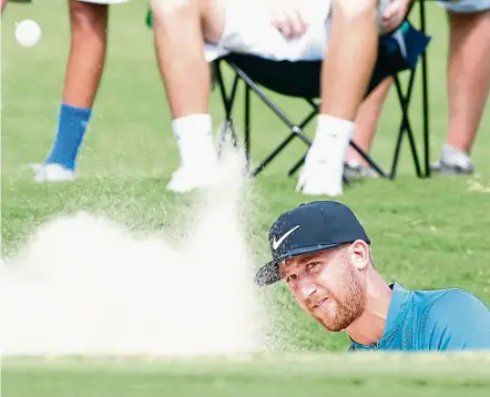  ??  ?? Out of trouble: Kevin Chappell shoots from a bunker on the fourth hole during the third round of the Tour Championsh­ip at East Lake Golf Club on Saturday. — EPA