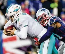 ?? ADAM GLANZMAN / GETTY IMAGES ?? The Dolphins (with backup QB Matt Moore being sacked by Patriots cornerback Jonathan Jones on Nov. 26), have minimal margin for error if they’re going to beat New England.