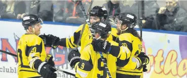  ?? Gw-images.com ?? Widnes Wild players celebrate one of their six goals against the Altrincham Aces in the 6-1 victory at Planet Ice Widnes on Sunday evening.