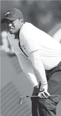  ?? AP ?? Tiger Woods of the US agonises after playing from the eighth tee during a foursome match on the second day of the 42nd Ryder Cup at Le Golf National in Saint-Quentin-en-Yvelines, outside Paris, France, September 29.