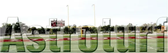  ?? MARK HUMPHREY ENTERPRISE-LEADER ?? The end zones of the newly installed artificial turf at Lincoln’s Wolfpack Stadium are decorated in school colors of maroon and white.