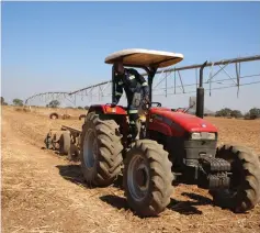  ?? ?? Patrick Matadi prepares land for winter wheat farming in Lion’s Den, Mashonalan­d West province