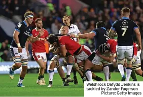  ?? ?? Welsh lock Dafydd Jenkins is tackled by Zander Fagerson
Picture: Getty Images