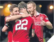  ??  ?? ■ Adam Rooney (right) celebrates the Dons’ fifth.