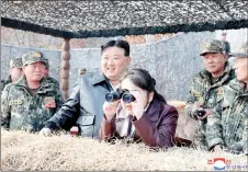  ?? — AFP photo ?? Picture released from North Korea’s official Korean Central News Agency (KCNA) shows Kim (centre left) and his daughter Ju Ae inspecting a training of the Korean People’s Army at an undisclose­d location in North Korea.