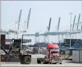  ?? WILFREDO LEE — THE ASSOCIATED PRESS FILE ?? A truck leaves the docks at PortMiami in Miami. On Thursday, the Commerce Department issued the second estimate of how the U.S. economy performed in the fourth quarter.