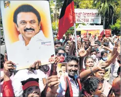  ??  ?? DMK members celebrate the party’s win in the state elections, in Chennai on Sunday.