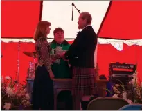  ?? ?? Nancy Love and Kenton Adler exchange vows with Father John Chiarmonte presiding at the Scottish Festival in 2008.