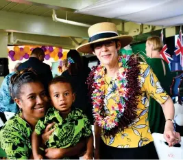  ?? Photo: ILISAPECI TUIVALE ?? The wife of the Australian Governor General, Linda Hurley, with a market vendor at the Nausori Market during the opening of the women’s accommodat­ion centre.