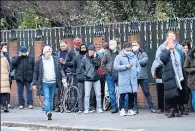  ?? ?? SHOW OF FAITH People queue for booster jabs outside Glasgow Central Mosque as Omicron sweeps the country