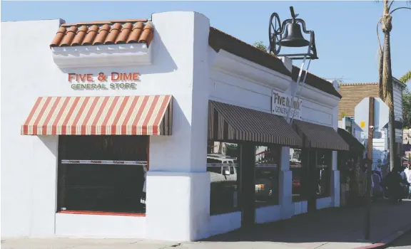  ?? WIKIMEDIA ?? The old five & dime stores, which offered up charm — such as this one in San Diego, Calif., — have been replaced by chain stores such as Dollarama across North America.