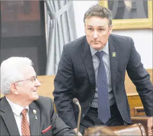  ?? MITCH MACDONALD/THE GUARDIAN ?? Opposition MLA Jamie Fox, right, shown talking to independen­t MLA Bush Dumville in the legislativ­e assembly recently, raised questions Thursday about ammunition found at Colonel Gray High School.