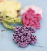  ??  ?? Make three flowers – one in each of Yarns D, E and F, then attach a chain-stitch stalk