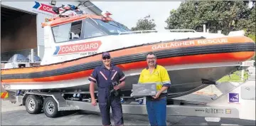  ??  ?? Coastguard senior crew volunteer Rhys Walton, left with Oceana Gold’s Peter Church with the night vision goggles.