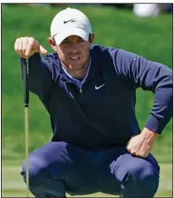  ?? (AP/John Raoux) ?? Rory McIlroy of Northern Ireland surveys a putt on the eighth hole Thursday during the first round of the PGA’s Bay Hill Invitation­al in Orlando, Fla. McIlroy shot a 6-under 66 and shares the tournament lead with Corey Connors.