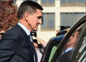  ?? The Associated Press ?? Former Trump national security adviser Michael Flynn leaves federal court in Washington, Friday. Flynn pleaded guilty to making false statements to the FBI, the first Trump White House official to make a guilty plea so far in a wide-ranging...