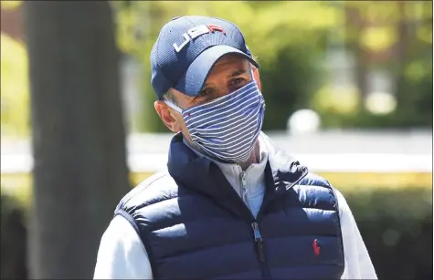  ?? Tyler Sizemore / Hearst Connecticu­t Media ?? Greenwich First Selectman Fred Camillo wears a face covering outside Greenwich Hospital in May.