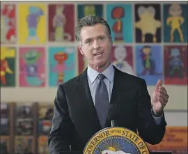  ?? Jeff Chiu Associated Press ?? GOV. GAVIN NEWSOM signed a bill that has some oversight board reforms but doesn’t alter the balance from a physician majority to a public member majority.