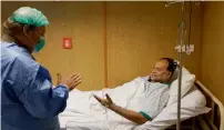  ?? Courtesy Geo TV ?? Former prime minister Nawaz Sharif visits Ahsan Iqbal at Servcies Hospital in Lahore on Tuesday. —