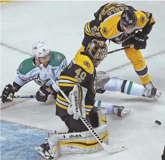  ?? STAFF PHOTO BY MATT STONE ?? PUCK STOPS HERE: Tuukka Rask makes a save during the Bruins’ win over the Stars last night at the Garden.