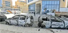  ?? (AFP) ?? A view of vehicles destroyed during fighting between forces loyal to the Tripoli-based PM Abdulhamid Dbeibah and rival forces of the Tobruk-based government, in Libya’s capital Tripoli on Tuesday