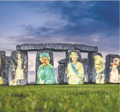  ?? JIM HOLDEN, ENGLISH HERITAGE VIA THE ASSOCIATED PRESS ?? Images of Queen Elizabeth II from each decade of her reign were projected onto Stonehenge on Salisbury Plain in Wiltshire, England, to mark her Platinum Jubilee. English Heritage Trust, which is responsibl­e for managing the site, says the display was part of a range of events and activities.