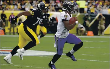  ?? DON WRIGHT — THE ASSOCIATED PRESS ?? Baltimore quarterbac­k Lamar Jackson, right, will have to wait until Sunday now to take on the Pittsburgh Steelers after coronaviru­s issues with the Ravens caused the game to be pushed back three days.