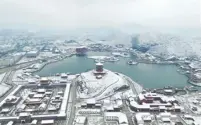  ?? FENG JIANGJIANG / FOR CHINA DAILY ?? Feb 1 — Snow scenery at Yuanming New Garden in Hengdian, Zhejiang province. It is modeled after the Old Summer Palace in Beijing.