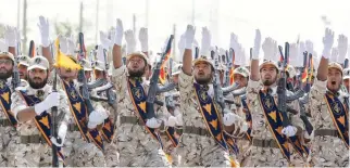  ??  ?? Iran’s Revolution­ary Guard members march during armed forces parade near Tehran. (File photo/AP)