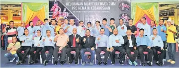  ??  ?? Participan­ts of the National Muaythai Pro and Amateur Referee Course posing after the course. PMS president Jumaat is seen seated fourth left.