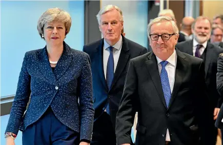  ?? AP ?? British Prime Minister Theresa May, left, European Union chief Brexit negotiator Michel Barnier and European Commission President Jean-Claude Juncker walk to their meeting at the European Commission headquarte­rs in Brussels yesterday.