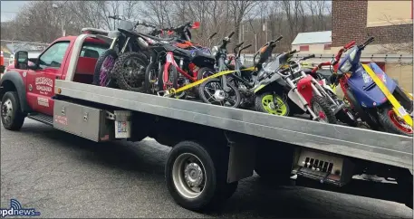  ?? BOSTON POLICE DEPARTMENT PHOTO ?? A police investigat­ion into groups involved in “illegal drag racing” led to officers seizing 37 dirt bikes and mopeds.