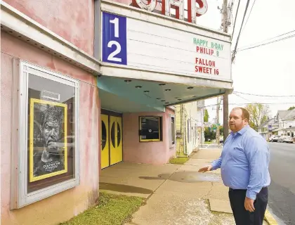  ?? PHOTOS BY HARRY FISHER/THE MORNING CALL ?? Slate Belt Rising Director Stephen Reider looks over the Gap Theatre in Wind Gap, which he hopes will get a facade makeover. There’s plenty of traffic on Broadway in Wind Gap, but ‘the problem is, you need to give people a reason to stop,’ Reider said.