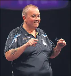  ?? Picture: Getty. ?? Phil Taylor has pointed to the positive impact City of Culture status can have, and wished Perth well in its bid. The darts legend will be playing old rival Raymond van Barneveld at the Dewar’s Centre on Saturday May 13.