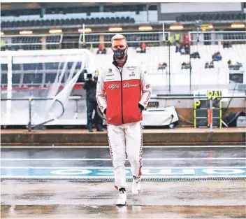  ?? FOTO: FIRO SPORTPHOTO ?? Spaziergan­g im Regen statt symbolträc­htige Runden im Formel-1-boliden: Mick Schumacher hatte sich den Freitag am Nürburgrin­g wahrlich anders vorgestell­t.