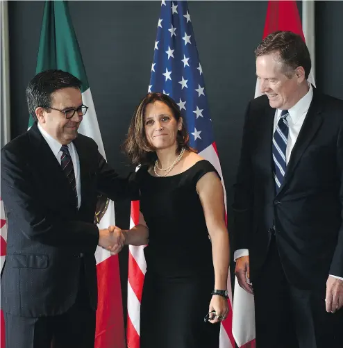  ?? SEAN KILPATRICK / THE CANADIAN PRESS FILES ?? Mexico’s Economy Secretary Ildefonso Guajardo Villarreal, left, Foreign Affairs Minister Chrystia Freeland and U. S. trade representa­tive Robert E. Lighthizer. The NAFTA renegotiat­ion is also a governance challenge for directors.