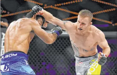  ?? Gregory Payan The Associated Press ?? William Hill lists Justin Gaethje, right, as a +160 underdog for his May 9 interim lightweigh­t title fight against Tony Ferguson.