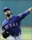  ?? TONY DEJAK — THE ASSOCIATED PRESS ?? The Rangers’ Cole Hamels delivers in the first inning against the Indians Monday.