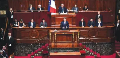  ??  ?? VERSAILLES: French President Emmanuel Macron (center) speaks during a special congress gathering both houses of parliament (National Assembly and Senate) in the palace of Versailles, outside Paris yesterday. — AFP