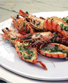  ??  ?? GRILLED PRAWNS WITH CHILLIES AND CORIANDER