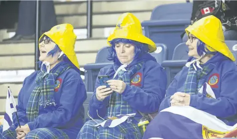  ?? BOB TYMCZYSZYN/STANDARD STAFF ?? Fans show their support for Nova Scotia during the Scotties Tournament of Hearts. Read the story on page A3 about some of the fancy headwear and hair on display daily at Meridan Centre this week. For more coverage of the event,