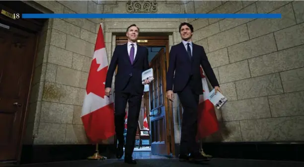  ?? Adam Scotti photo ?? Finance Minister Bill Morneau and Prime Minister Justin Trudeau leave the PM”s office to deliver Budget 2018 on February 27.