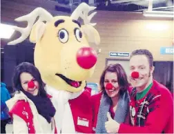  ??  ?? Dave McCloskey, far right, volunteers with Operation Red Nose in the Tri Cities.